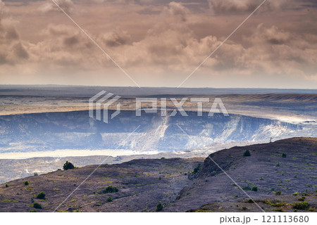 Large volcano in Mauna Loa. Landscape of smoky mountain on Big Island, Hawaii. A dormant volcano in open secluded area. Overcast sky with steaming volcanic area and a crater 121113680