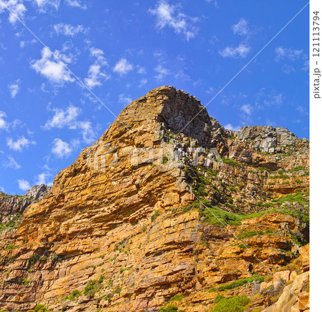 Low angle view of a mountain peak in South Africa. Scenic landscape of a remote hiking location on Lions Head in Cape Town during a sunny day. Travelling and exploring nature through adventure 121113794