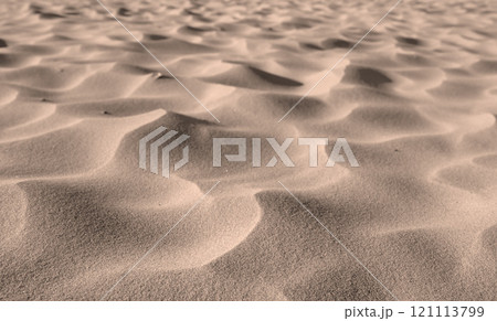 Grains of desert sand from dunes on windy beach in nature with copyspace. Closeup of scenic landscape outdoors with rough and rippled surface texture. Coastal region to explore for travel and tourism 121113799