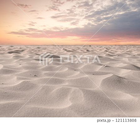 Beach sand dunes in nature with moody twilight sky background and copyspace. Closeup of a scenic landscape outdoors with grainy surface texture. Calm desert to explore for travel and tourism Beach sand dunes in nature with moody twilight sky background and copyspace. Closeup of a scenic landscape outdoors with grainy surface texture. Calm desert to explore for travel and tourism 121113808