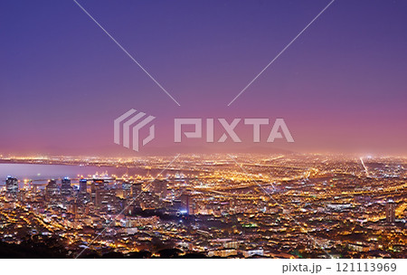 Cape Town after sunset, a cityscape view from Signal Hill, South Africa. Bright lights over a city landscape on a beautiful summer evening. panoramic of the city. Illuminated buildings and streets 121113969
