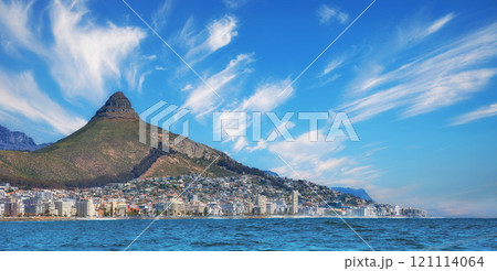 Copy space, panorama seascape with clouds, blue sky, hotels, and apartment buildings in Sea Point, Cape Town, South Africa. Lions head mountain overlooking the beautiful blue ocean peninsula Copy space, panorama seascape with clouds, blue sky, hotels, and apartment buildings in Sea Point, Cape Town, South Africa. Lions head mountain overlooking the beautiful blue ocean peninsula 121114064