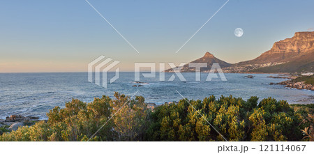 Landscape view of sea water, mountains and a blue sky with copy space of Lions Head and Table Mountain in Cape Town, South Africa. Calm, serene, tranquil, ocean and relaxing nature scenery at sunrise Landscape view of sea water, mountains and a blue sky with copy space of Lions Head and Table Mountain in Cape Town, South Africa. Calm, serene, tranquil, ocean and relaxing nature scenery at sunrise 121114067