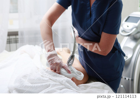Hardware cosmetology. Anti-cellulite massage of the femoral zone in beauty salon. Body care. Non-surgical correction of figure. Hardware cosmetology. Anti-cellulite massage of the femoral zone in beauty salon. Body care. Non-surgical correction of figure. 121114113