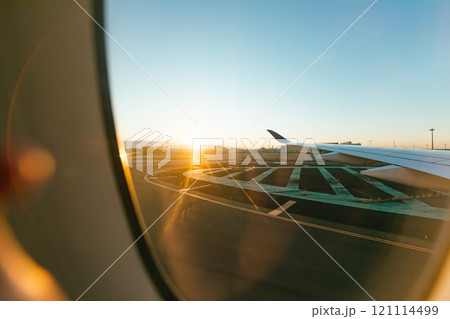 sunrise view from airplane window 121114499