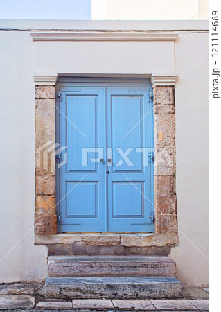 Front view Athens house, blue wooden door 121114689