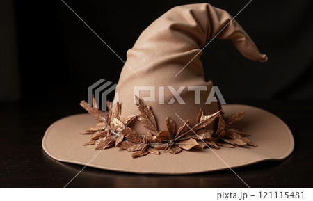 Mocha mousse-colored Halloween witch's hat with glittering accents - A stylish witch's hat for Halloween, decorated in mocha mousse 121115481