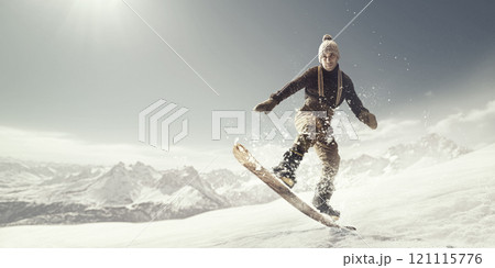 Vintage-dressed snowboarder gracefully balancing on snow, immersed in serene winter atmosphere, against soft light and panoramic mountain views. 121115776