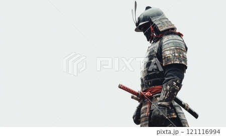 A lone samurai stands in contemplative silence. Clad in traditional armor, he embodies honor and resilience. His sword rests at his side. Generative AI 121116994