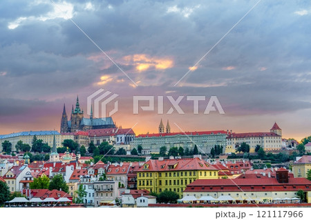 Picturesque Prague cityscape with historic buildings and cloudy sky at sunset Picturesque Prague cityscape with historic buildings and cloudy sky at sunset 121117966