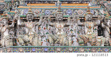 Yaksha and monkey supporting figures decorating the prang of the Arun Temple in Bangkok, Thailand 121118513
