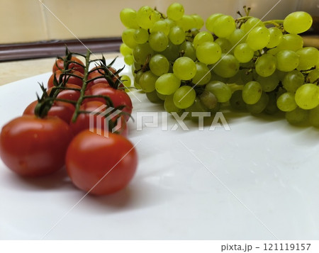 Green ripe juicy grapes on the table. Green ripe juicy grapes on the table. 121119157