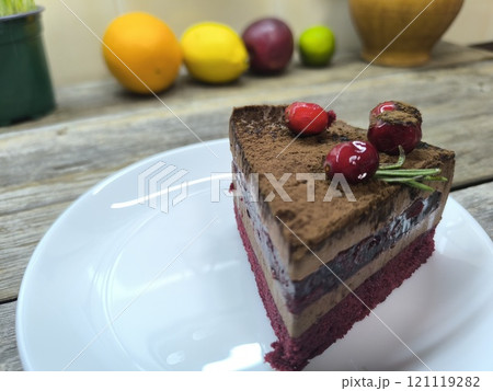 Puff pastry with cherries on a plate. High-quality photos for photography 121119282