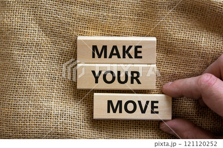 Make your move symbol. Wooden blocks with words 'Make your move'. Beautiful canvas background, businessman hand. Business, make your move concept, copy space. 121120252