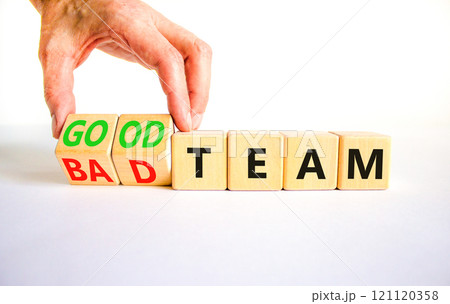Good or bad team symbol. Concept words Good team Bad team on wooden cubes. Beautiful white table white background. Businessman hand. Business and good or bad team concept. Copy space. Good or bad team symbol. Concept words Good team Bad team on wooden cubes. Beautiful white table white background. Businessman hand. Business and good or bad team concept. Copy space. 121120358