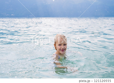 Smiling child in the water Smiling child in the water 121120555