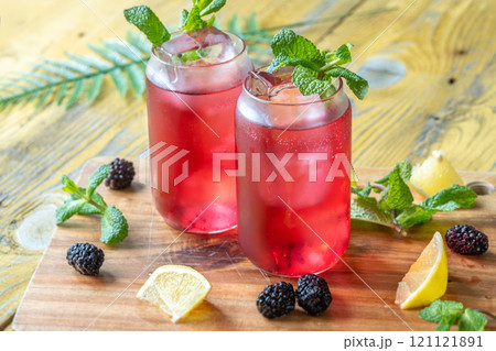 Blackberry Fizz Mocktail with mint, lime, and honey for a refreshing sip 121121891