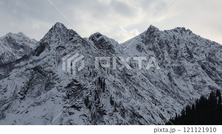 Snow-Covered Mountain Peaks and Clouds in Kalam, North Pakistan Snow-Covered Mountain Peaks and Clouds in Kalam, North Pakistan 121121910