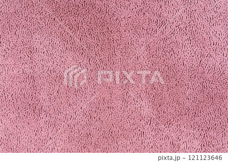 Pink color fabric cloth with short haired fluffy and soft abstract texture background. Close-up photo of crepe colored surface textile material, vivid background texture of fabric for design element 121123646