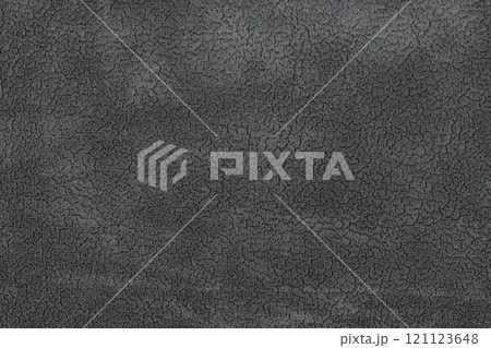 Black color fabric cloth with short pile fluffy and soft abstract texture background. Close-up photography of dark gray colored surface fabric material, colored background texture of cloth for design 121123648