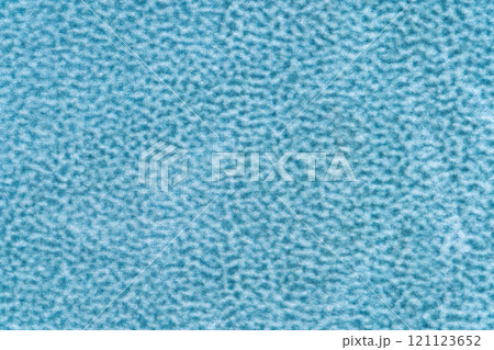 Light blue color velvet with short haired fluffy and soft texture background. Closeup of sapphire colour surface velour textile material, background fabric texture, free copy space for creative design 121123652