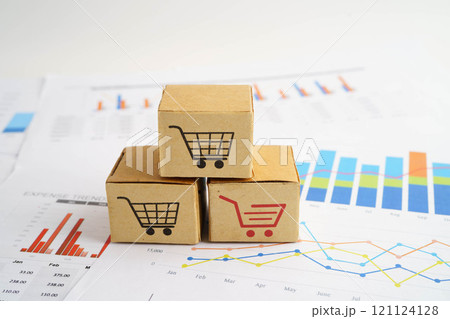 Online shopping, Shopping cart box on business graph, import export, finance commerce. Online shopping, Shopping cart box on business graph, import export, finance commerce. 121124128