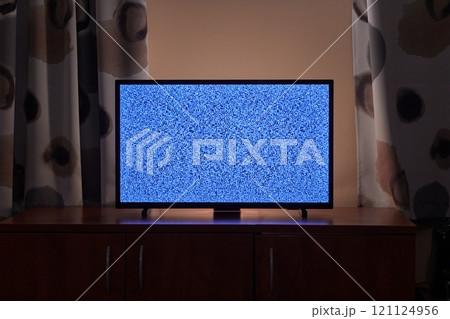 TV in a dim living room 121124956