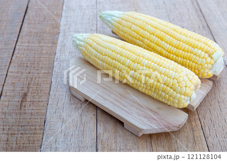 Sweet corn on wood table. Sweet corn on wood table. 121128104