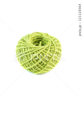 A roll of green jute twine placed on a white background, ideal for crafting, packaging, and DIY projects. Perfect for online stores or product catalogs showcasing eco-friendly materials A roll of green jute twine placed on a white background, ideal for crafting, packaging, and DIY projects. Perfect for online stores or product catalogs showcasing eco-friendly materials 121128564