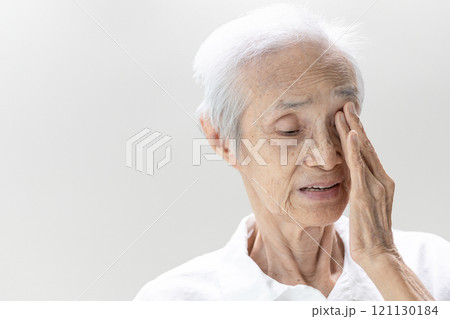 Asian senior woman with Age-related macular degeneration(AMD), degenerative of the retina or macula of the eye,blurred vision,old elderly touching her eye with hand,loss of sight,health care,medical 121130184