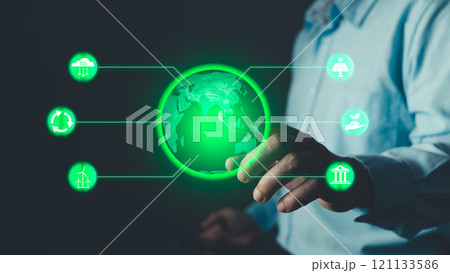 Climate change,hand hold hologram to save energy,and reduce global warming,ecology friendly investment,ESG environment social governance,Green Business Innovation and Sustainable Development concept. Climate change,hand hold hologram to save energy,and reduce global warming,ecology friendly investment,ESG environment social governance,Green Business Innovation and Sustainable Development concept. 121133586