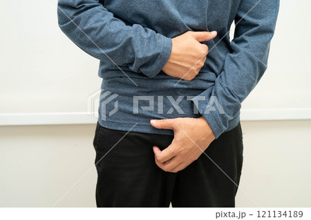 Hernia, Asian man stomach ache, abdominal pain and urology problem health. 121134189