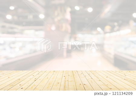 Empty wood table top with supermarket blurred background for product display Empty wood table top with supermarket blurred background for product display 121134209