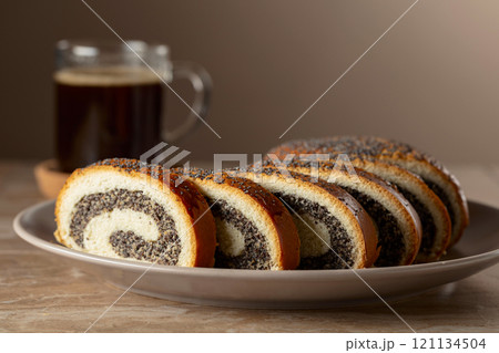 Poppy seed roll slices and black coffee. Poppy seed roll slices and black coffee. 121134504