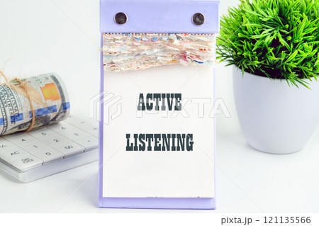 The concept of business and development. Conceptual text, phrase, words ACTIVE LISTENING It is written on a piece of desktop calendar on a white background 121135566