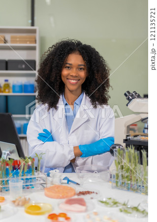 Portrait of a successful Microbiologist with inspiration in Modern Food Science Laboratory. Portrait of a successful Microbiologist with inspiration in Modern Food Science Laboratory. 121135721