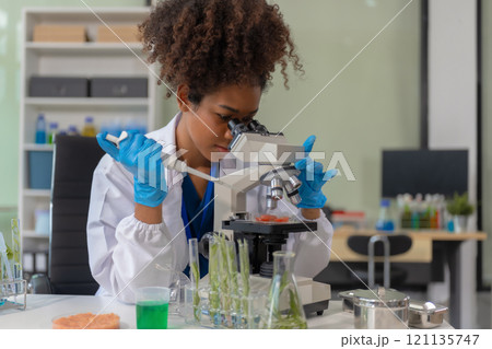 Microbiologist Working on Molecule Samples in Modern Food Science Laboratory, concentration of chemical residues. hazards, standard, find prohibited substances, contaminate. Microbiologist Working on Molecule Samples in Modern Food Science Laboratory, concentration of chemical residues. hazards, standard, find prohibited substances, contaminate. 121135747