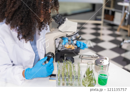 Microbiologist Working on Molecule Samples in Modern Food Science Laboratory, concentration of chemical residues. hazards, standard, find prohibited substances, contaminate. 121135757