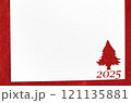 Christmas 2025 background. White paper with fir-tree shape cut for new year 2025 card on wooden table 121135881