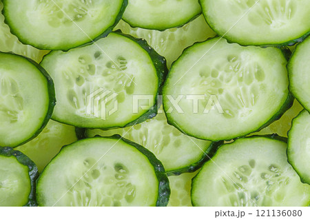 Cucumber slices as background. Vegetables cucumbers. 121136080