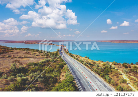 View from above of highway and rod bridge over Khadzhibey Estuary. Ukraine View from above of highway and rod bridge over Khadzhibey Estuary. Ukraine 121137175