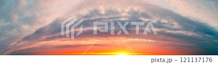Fantastic panorama of dramatic cloudy blazing sky in the evening. Clouds in shape arch. Colorful cloudy sky at sunset. Gradient color. Sky texture. Abstract nature background Fantastic panorama of dramatic cloudy blazing sky in the evening. Clouds in shape arch. Colorful cloudy sky at sunset. Gradient color. Sky texture. Abstract nature background 121137176