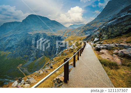 Walkway on the mountain. Trollstigen, Trolls Path, Norway Walkway on the mountain. Trollstigen, Trolls Path, Norway 121137307
