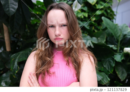 Portrait of a woman arms folded Portrait of a woman arms folded 121137829