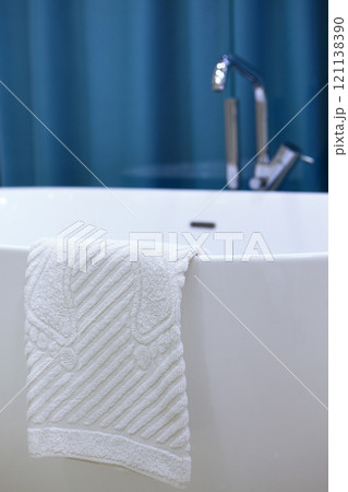 Bathroom interior. Foot towel. Bathroom accessories. Concept of hygiene and comfort. Vertical photo. Bathroom interior. Foot towel. Bathroom accessories. Concept of hygiene and comfort. Vertical photo. 121138390