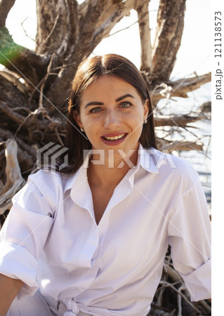 young pretty brunette woman on sea coast, lifestyle people concept close up young pretty brunette woman on sea coast, lifestyle people concept close up 121138573