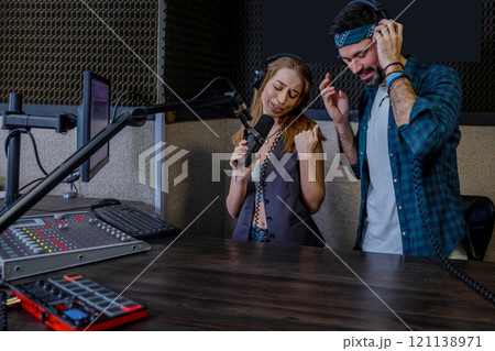 Hipster man and woman playback singers recording track 121138971