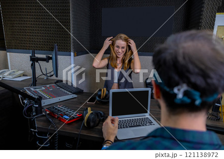 Man and woman working in studio 121138972