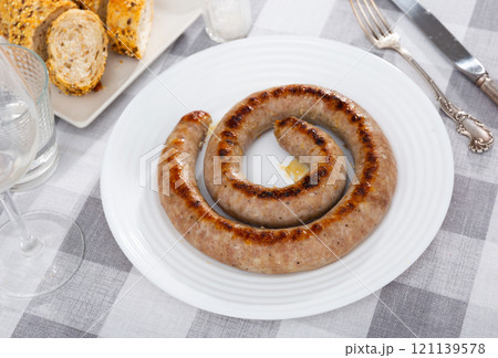Fried pork sausage served on platter Fried pork sausage served on platter 121139578