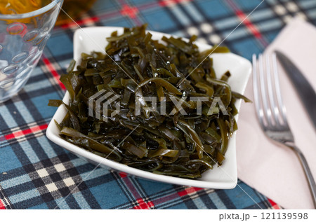 Traditional vegetable appetizer, salad of fresh seaweed. Traditional vegetable appetizer, salad of fresh seaweed. 121139598